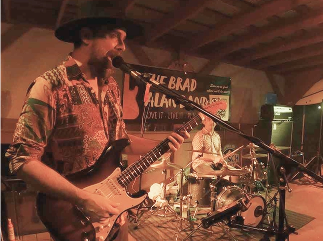 The Brad Alan Band playing a concert.